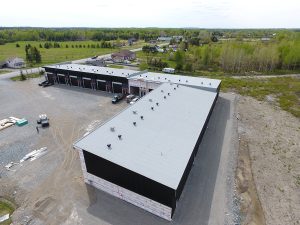 Service de toiture commercial en membrane élastomère à Longueuil, Boucherville, Brossard, Saint-Hubert et sur la Rive-Sud de Montréal / Couvreur Rive Sud